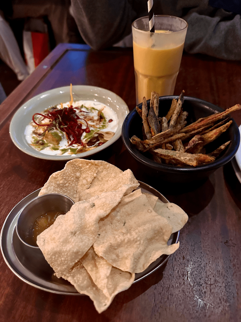 A photo of the starters at dog friendly restaurant, Dishoom, including okra fries and chaat